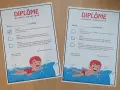 Deux diplômes d'aisance aquatique pour féliciter les champions de natation. Bravo !