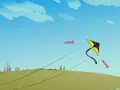 Un cerf-volant jaune et noir s'envole dans un ciel bleu. Une activité manuelle pour s'amuser dehors.