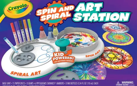 Station d'art rotatif Crayola avec marqueurs, encres et disques pour créer des spirales colorées.