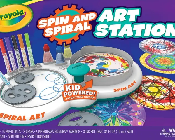 Station d'art rotatif Crayola avec marqueurs, encres et disques pour créer des spirales colorées.